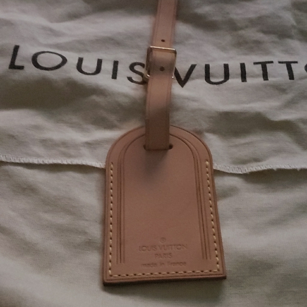 Authentic 100 percent  luggage tag